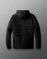 Black quilted jacket on a gray background