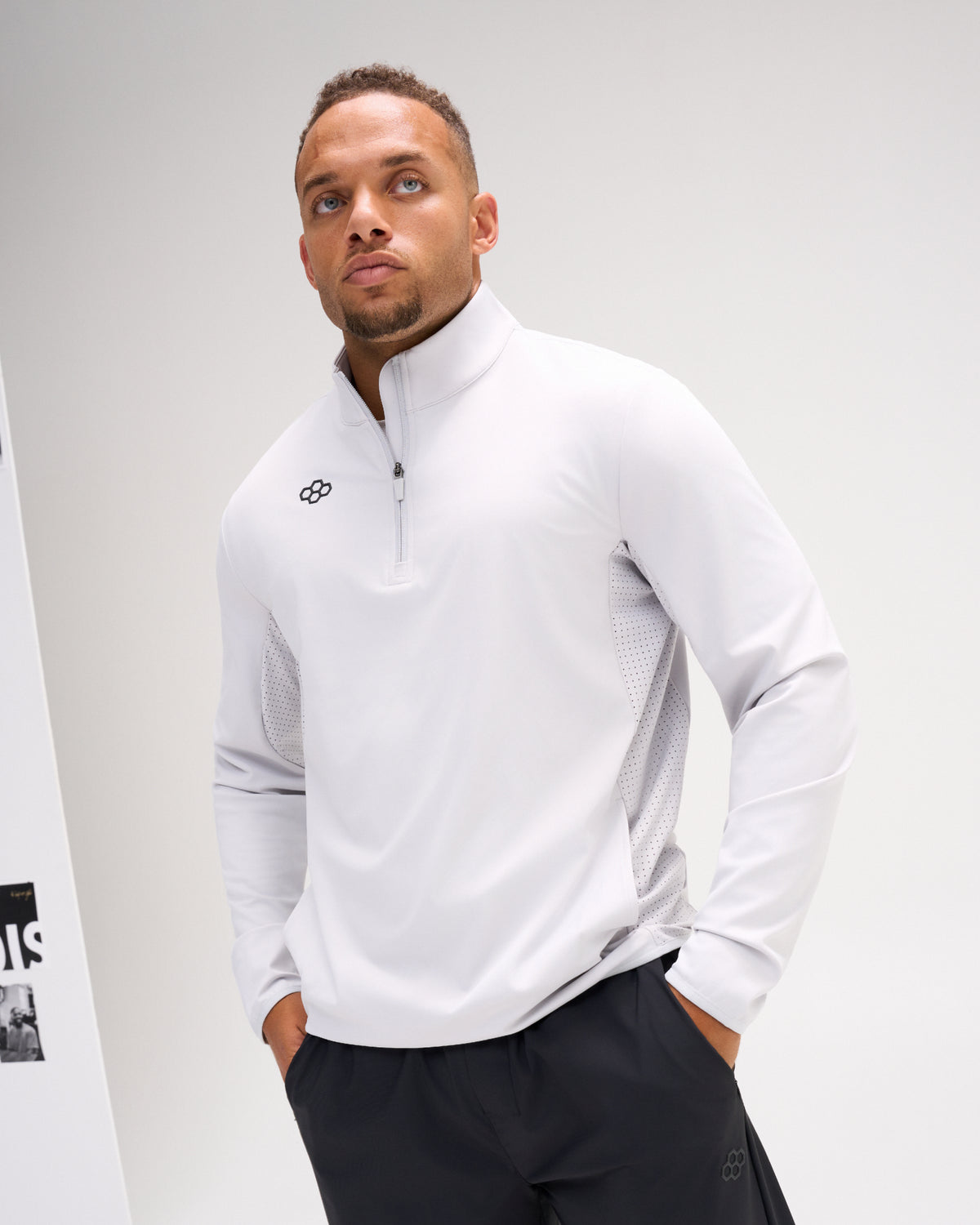 Model wearing the Lunar RUDIS Victory 1/4 Zip performance pullover with stand collar, quarter-zip closure, and ventilated side panels.