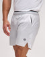 White athletic shorts with a small logo on a plain background