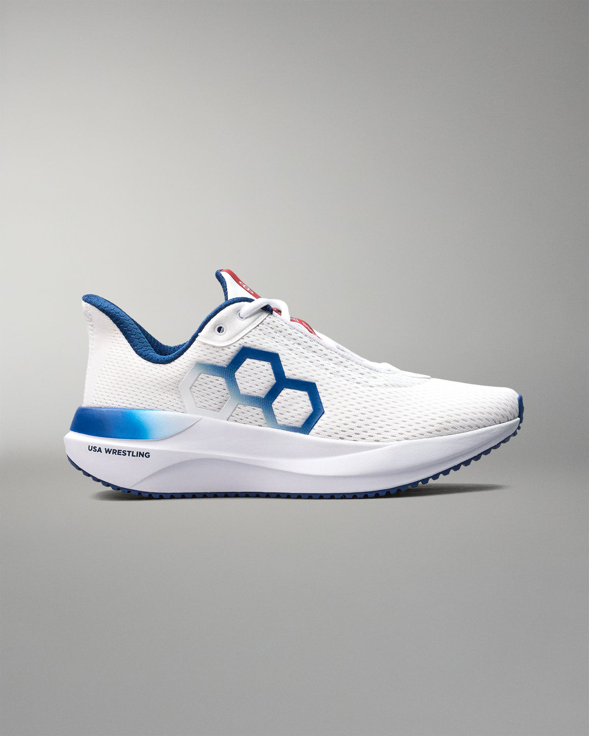 White athletic shoe with blue accents on a gray background