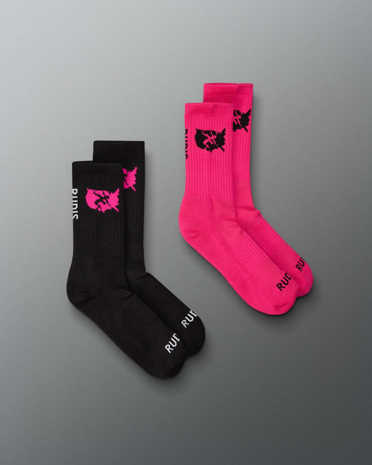 Two pairs of socks, one black and one pink, with a logo on a gray background.