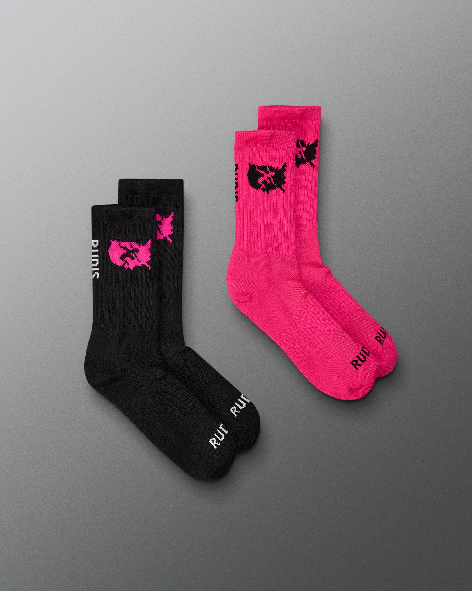 Two pairs of socks, one black and one pink, with a logo on a gray background.