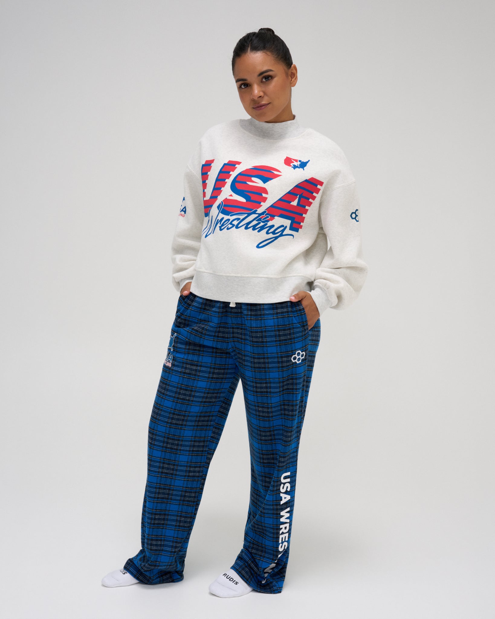 Model wearing RUDIS USA Wrestling Flannel Lounge Pants in Royal blue plaid with a relaxed, straight-leg fit and white USA Wrestling lettering