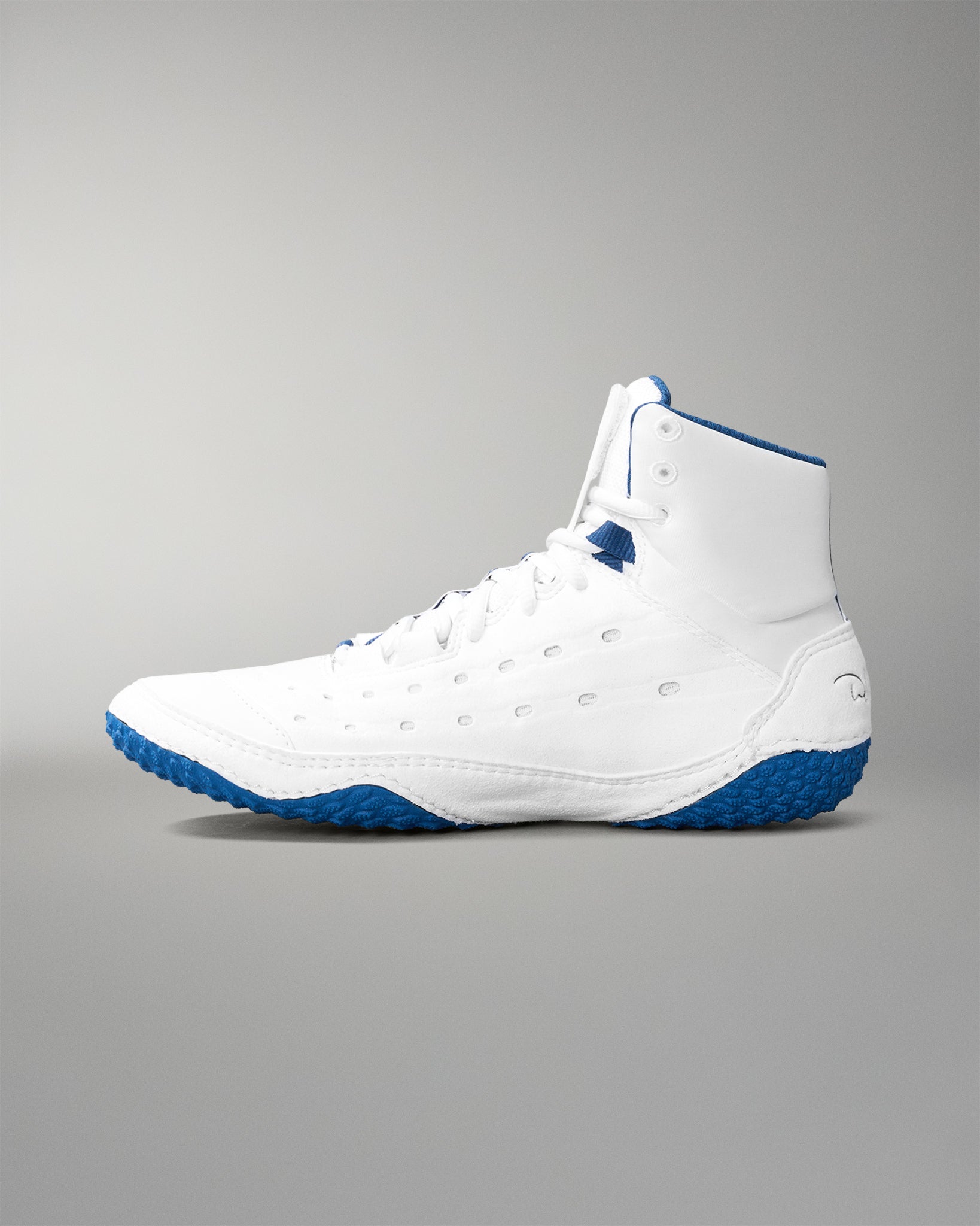 White wrestling shoe with blue soles on a gray background
