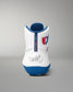 White wrestling shoe with blue sole and red and blue logo on a gray background