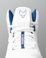 White wrestling shoe with blue accents and a logo on a gray background
