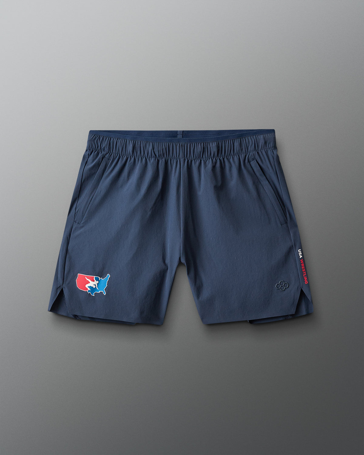 Blue athletic shorts with a USA Wrestling logo on a gray background