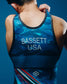 Back close-up of blue RUDIS USA Wrestling Shooting Star Elite 2.0 Singlet featuring BASSETT USA lettering, blue patterned fabric, and the RUDIS Hex logo.
