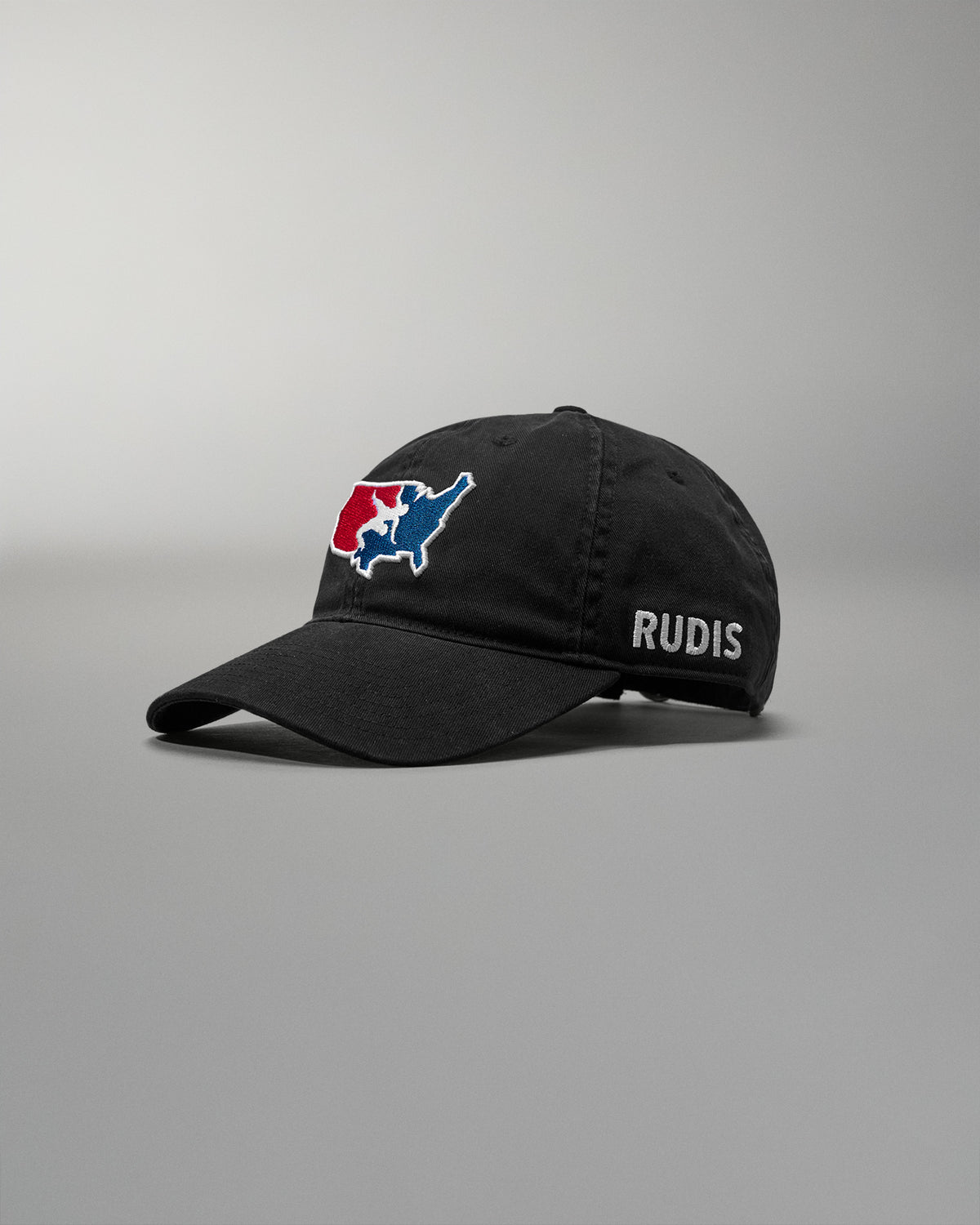 Black cap with a logo and 'RUDIS' text on a gray background