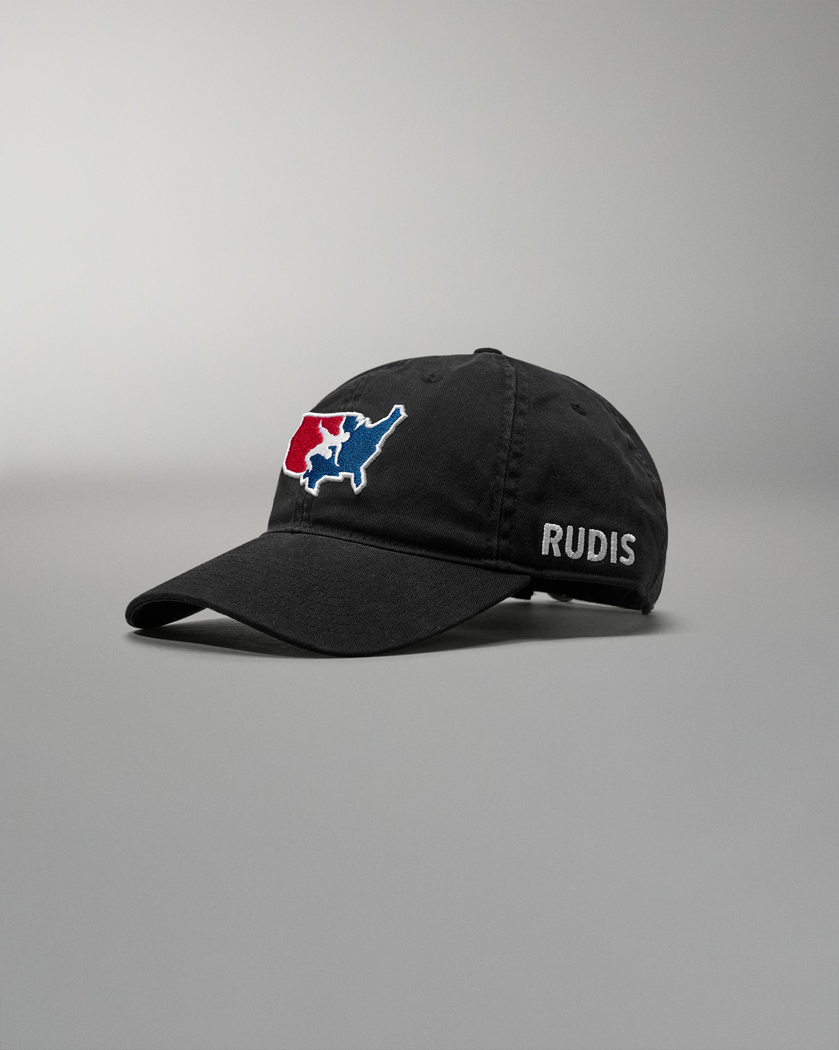Black cap with a logo and 'RUDIS' text on a gray background