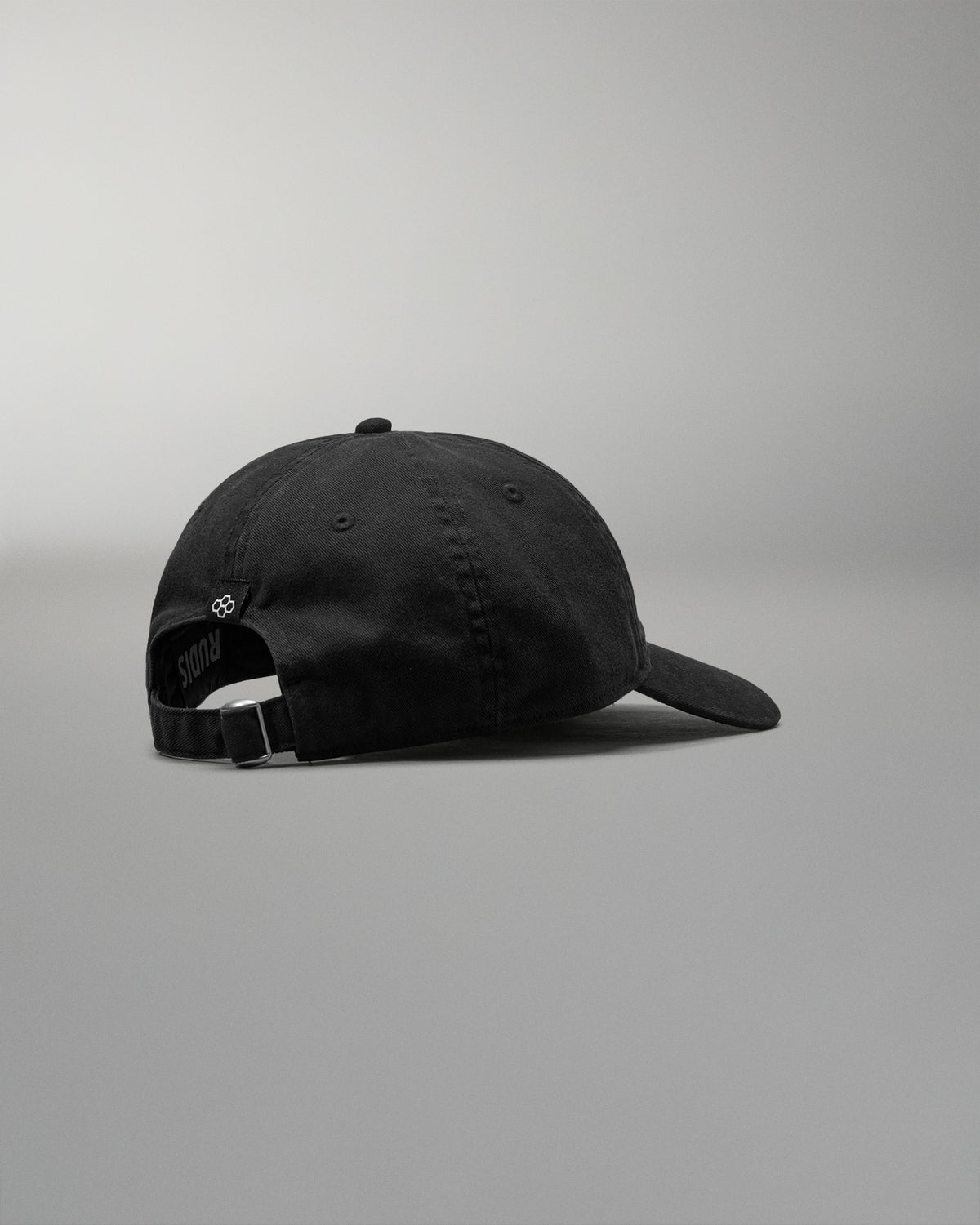 Black cap on a gray background