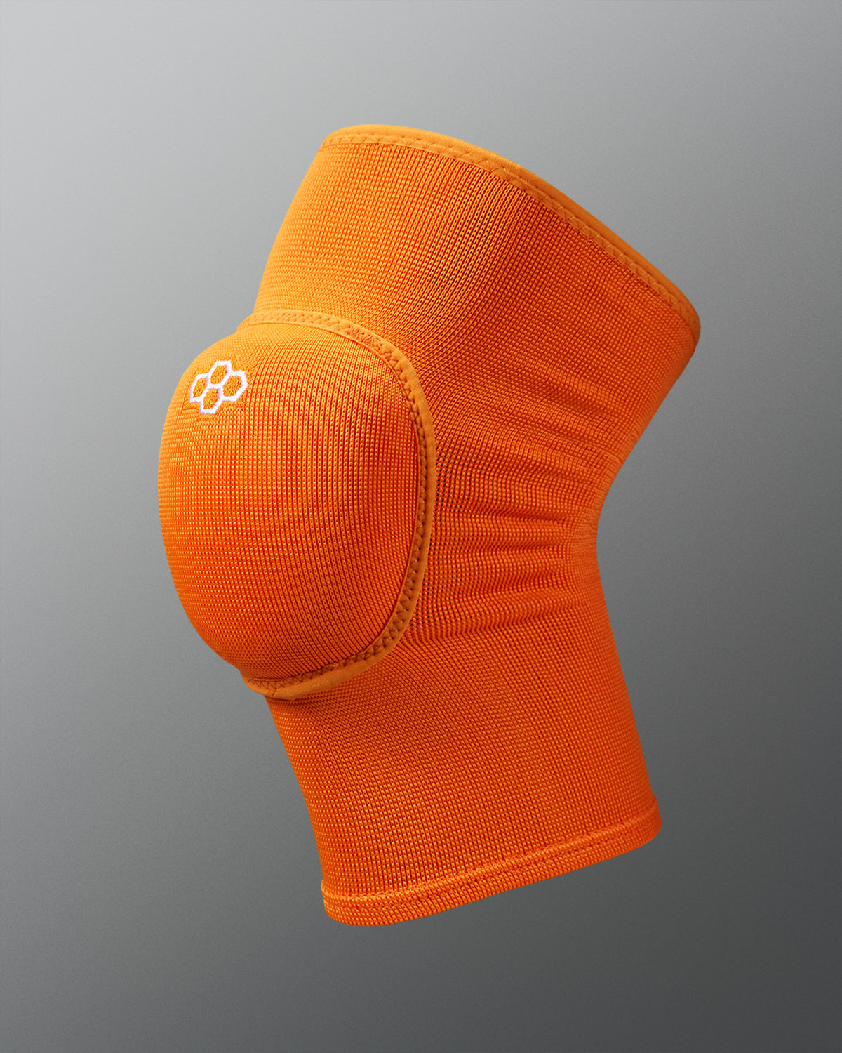 Orange knee pad on a gray background