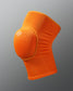 Orange knee pad on a gray background