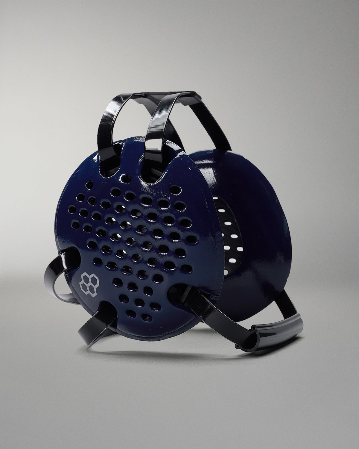 Blue and black grill on a gray background