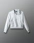 Light gray sweatshirt with a brand logo on a gray background