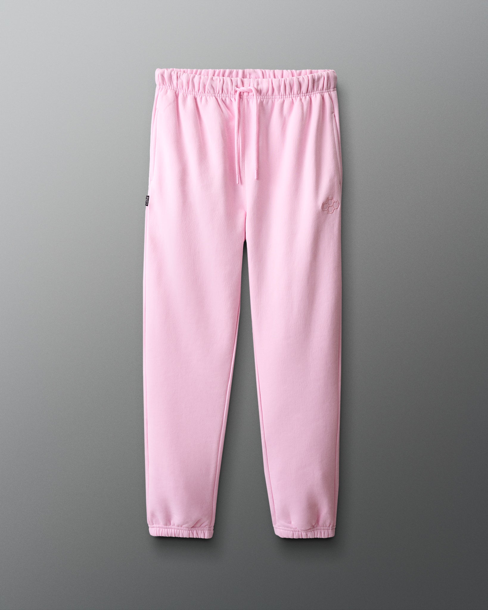 Pink sweatpants on a gray background