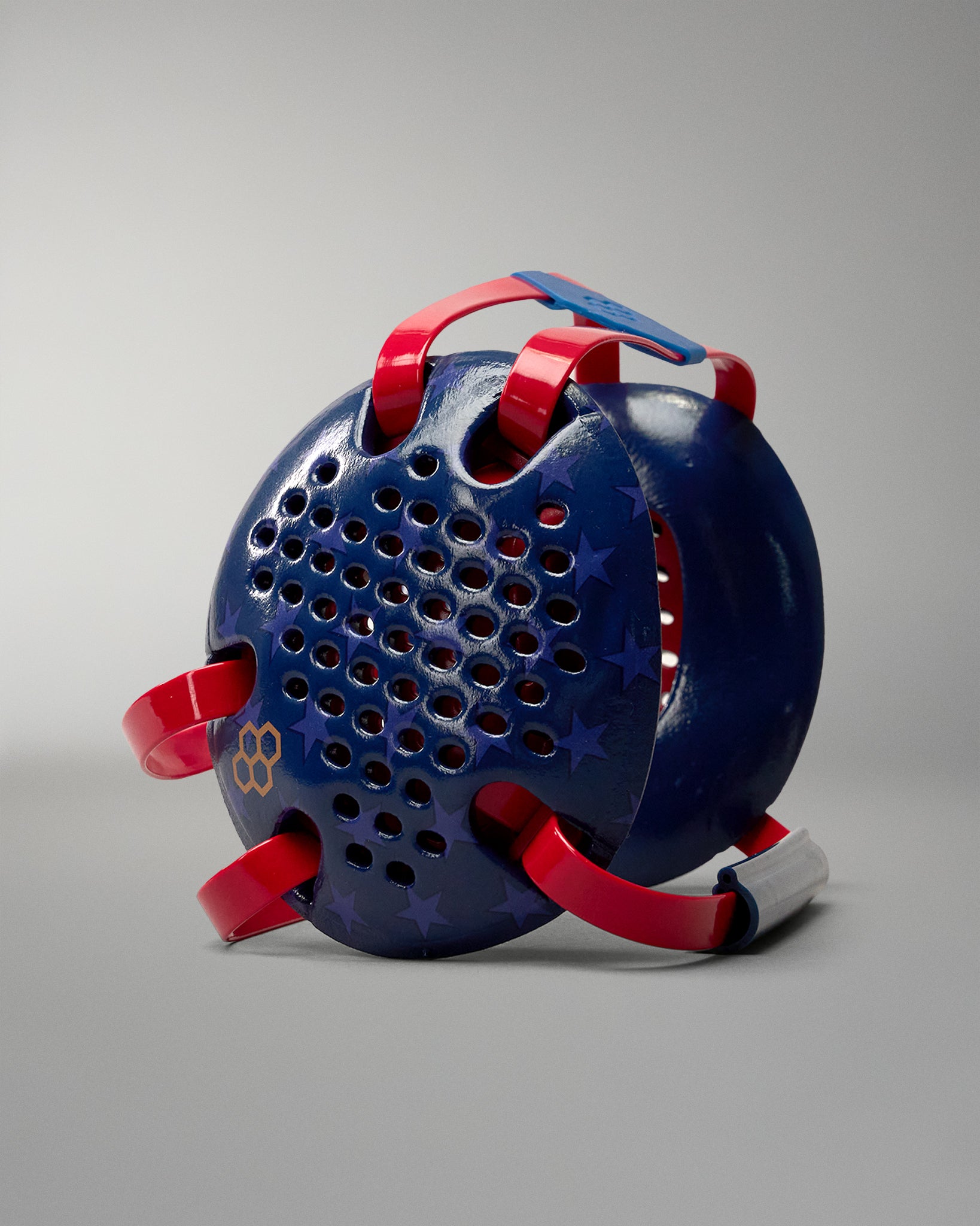 RUDIS Wonder Woman Elite Airflow Wrestling Headgear featuring navy blue ear guards with star graphics, red straps, ventilation holes and gold RUDIS logo.