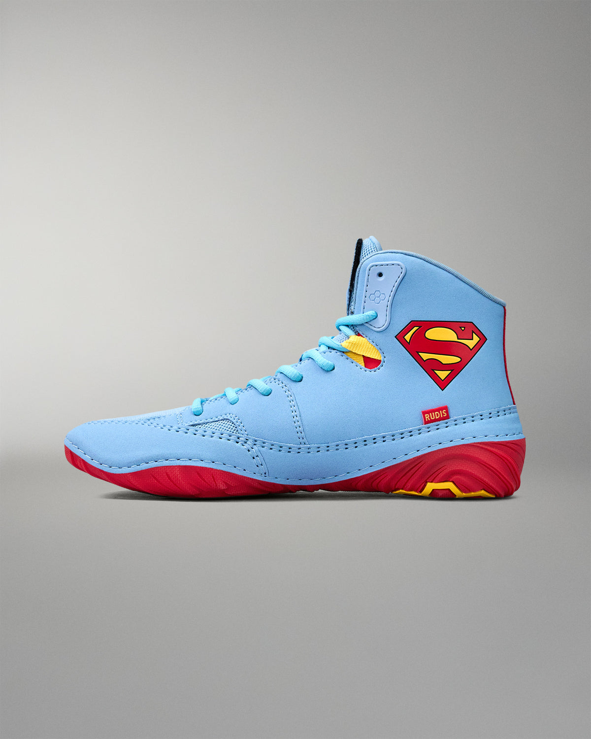 Opposite side view of RUDIS JB1 Superman wrestling shoe featuring the iconic red and yellow Superman shield.