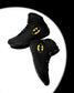 Two black high-top wrestling shoes with yellow Batman logos, floating against a white circular spotlight on a black background.