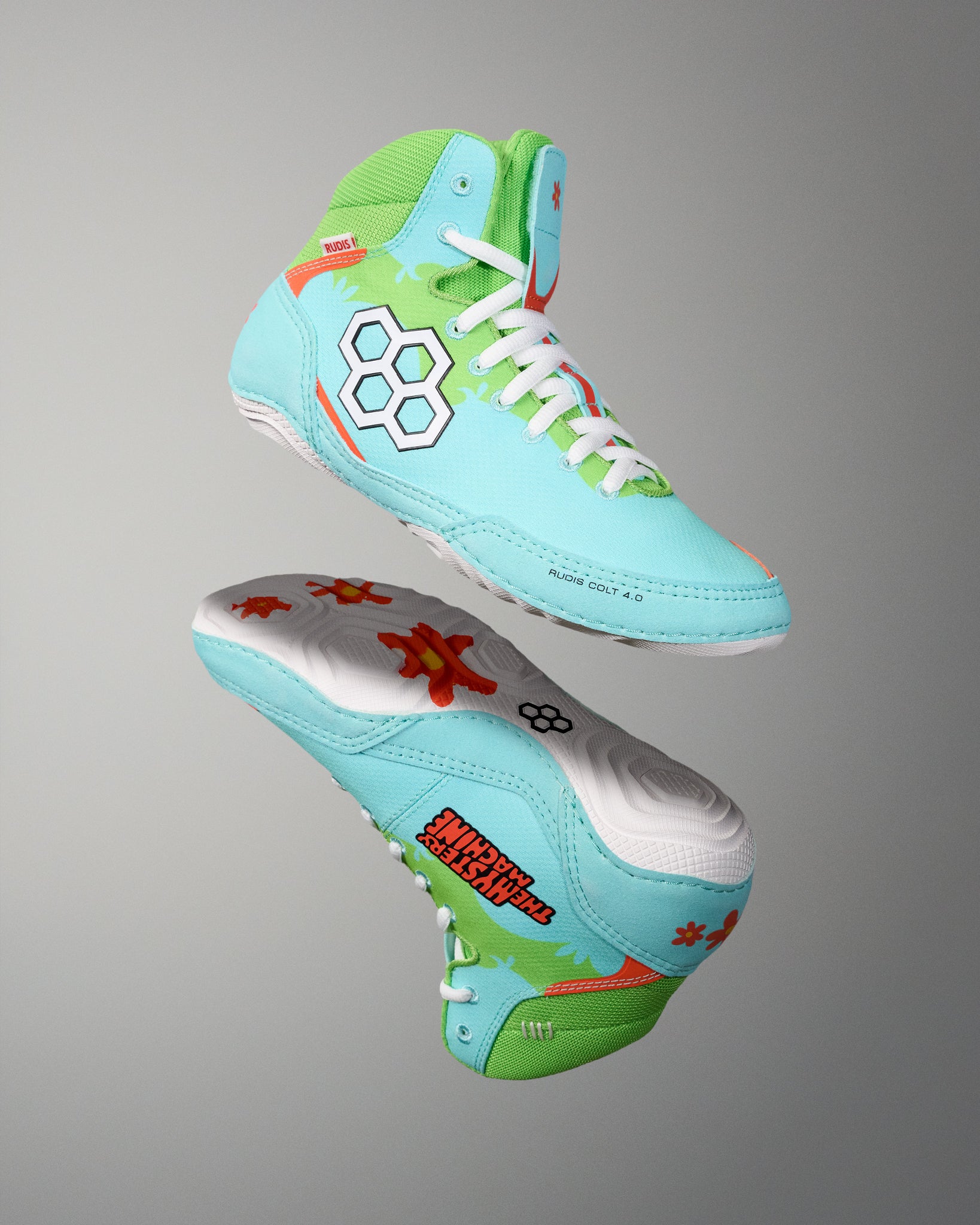 RUDIS Scooby-Doo Colt 4.0 wrestling shoes shown in angled side and outsole views, highlighting turquoise and green uppers, white soles, and orange flower graphics.