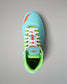 Top view of the RUDIS Scooby-Doo Colt 4.0 wrestling shoe highlighting white laces, turquoise toe box, green padded collar, and Mystery Machine-themed insole artwork.