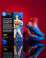 RUDIS Wonder Woman Hildebrandt 2.0 women's wrestling shoes displayed beside DC Wonder Woman collector packaging, featuring red, blue and gold superhero-inspired details.