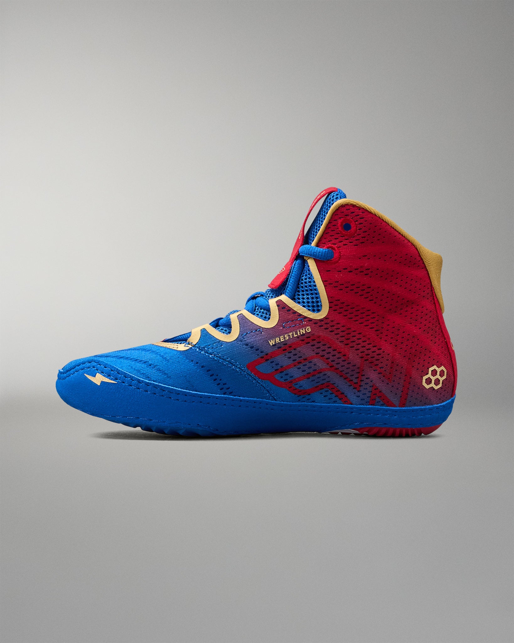 Inner side view of RUDIS Wonder Woman Hildebrandt 2.0 women's wrestling shoe, featuring a red-to-blue gradient, Wonder Woman graphic, blue sole and gold details.