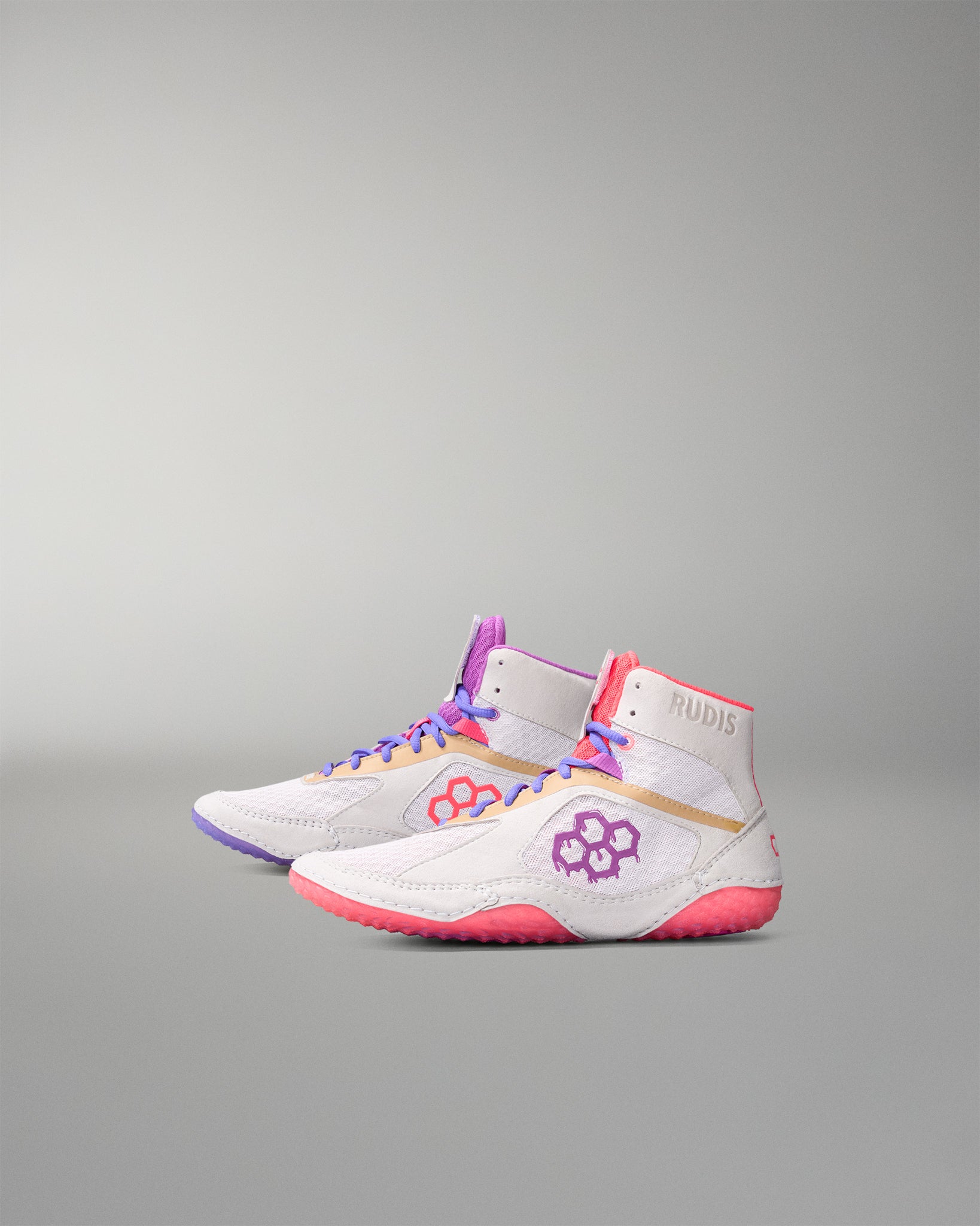 White wrestling shoes with colorful accents on a gray background