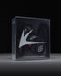 Box with wrestling shoes and a 'RUDIS' brand logo on a black background