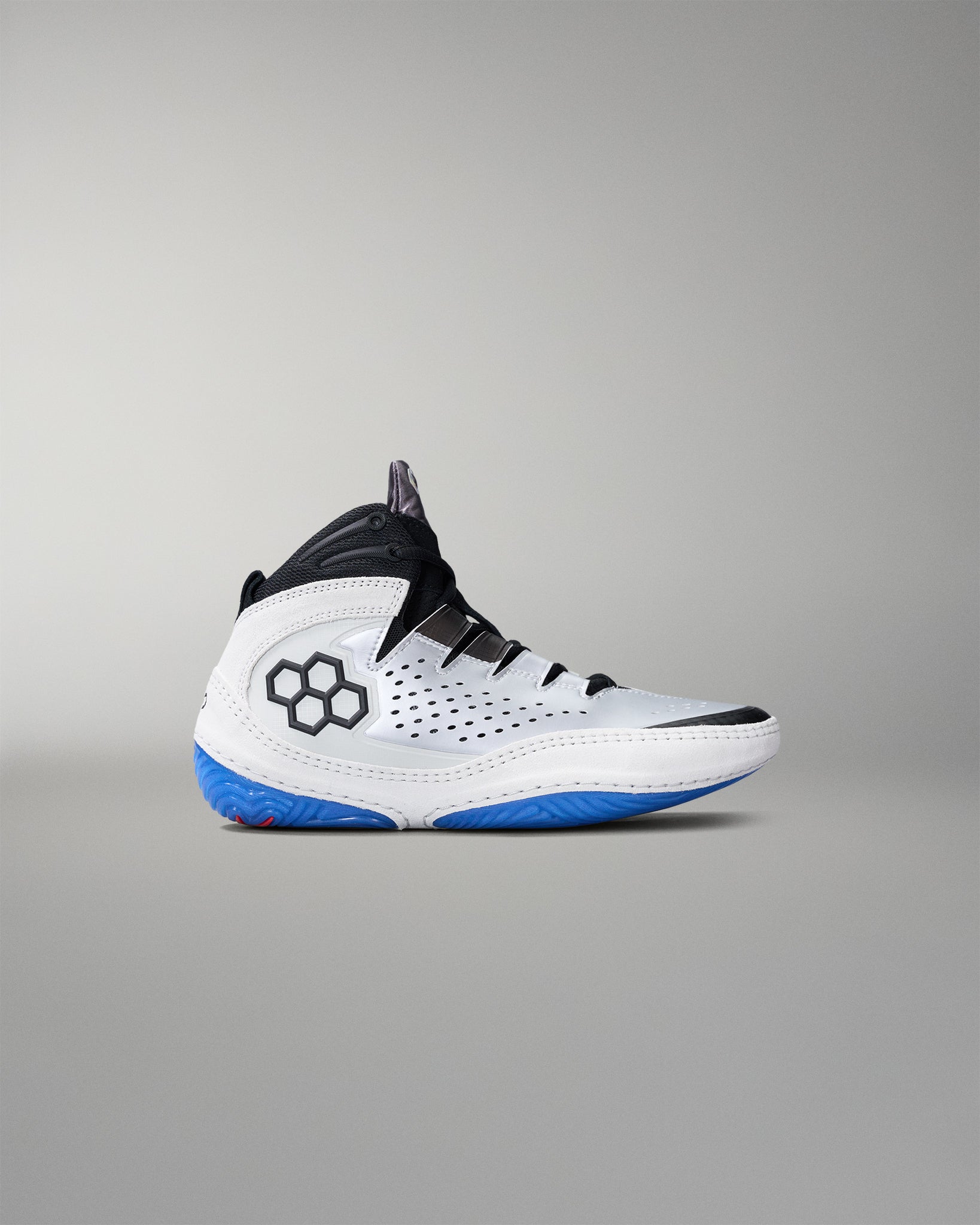 White wrestling shoe with blue sole on a gray background