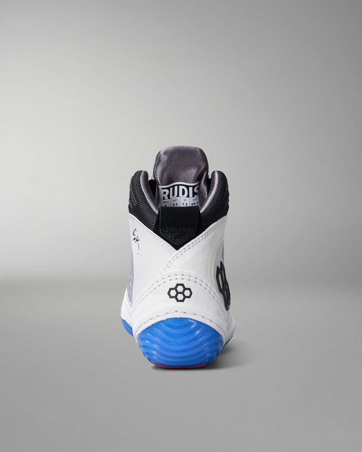 White wrestling shoe with blue sole on a gray background