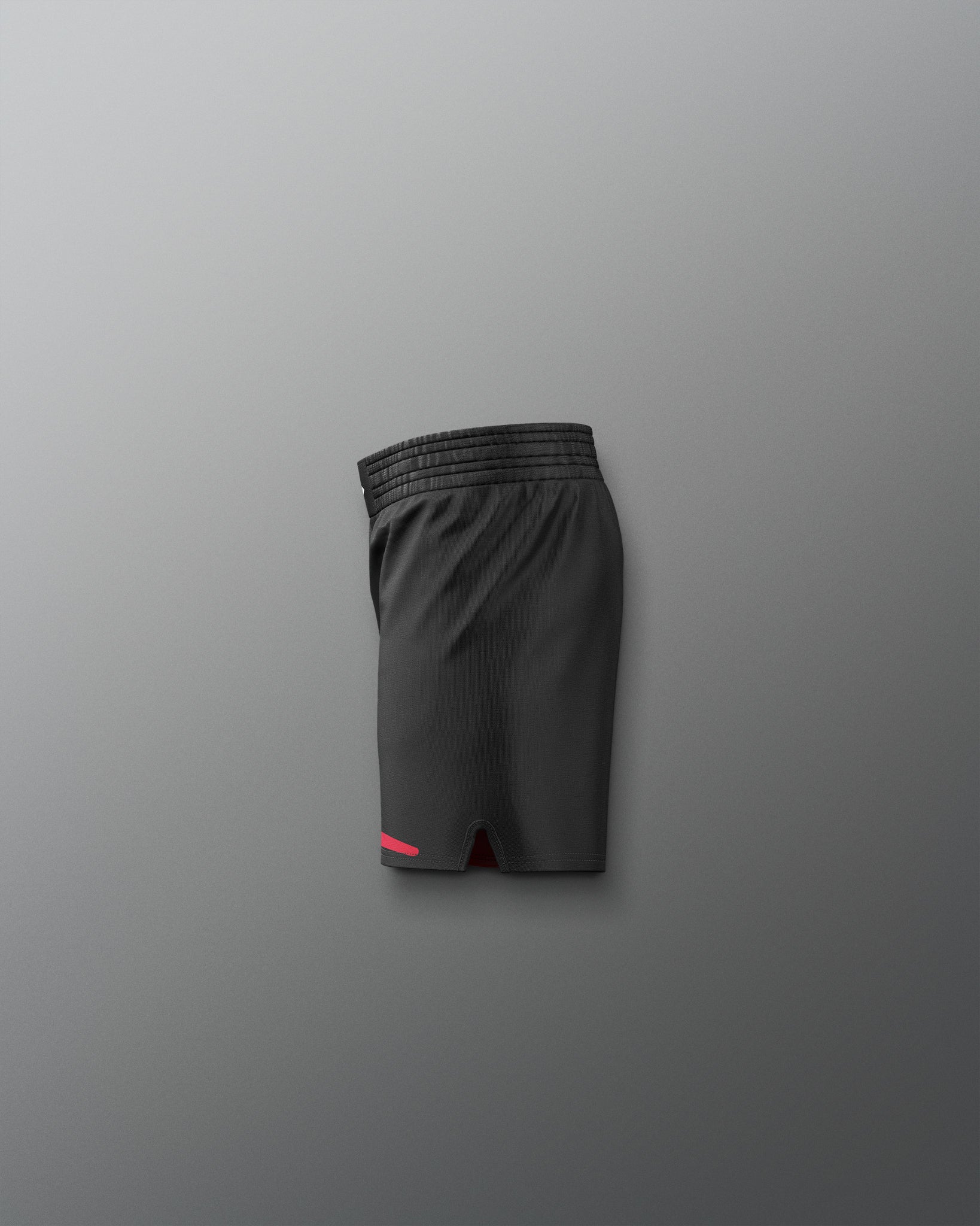 Black athletic shorts with a red 'Kolat' logo on a gray background