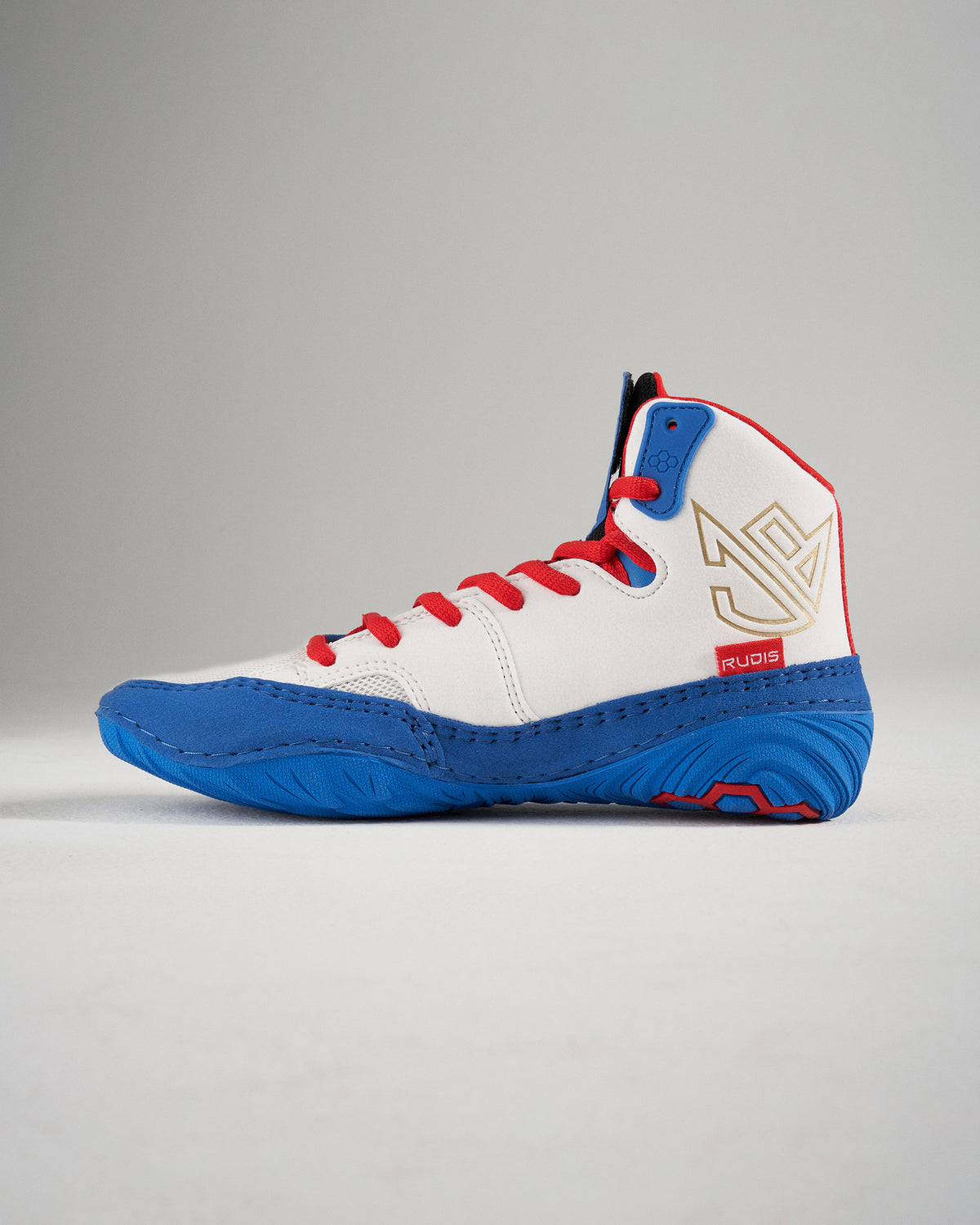 This image depicts a high-top athletic shoe predominantly white with blue and red accents designed for performance and style