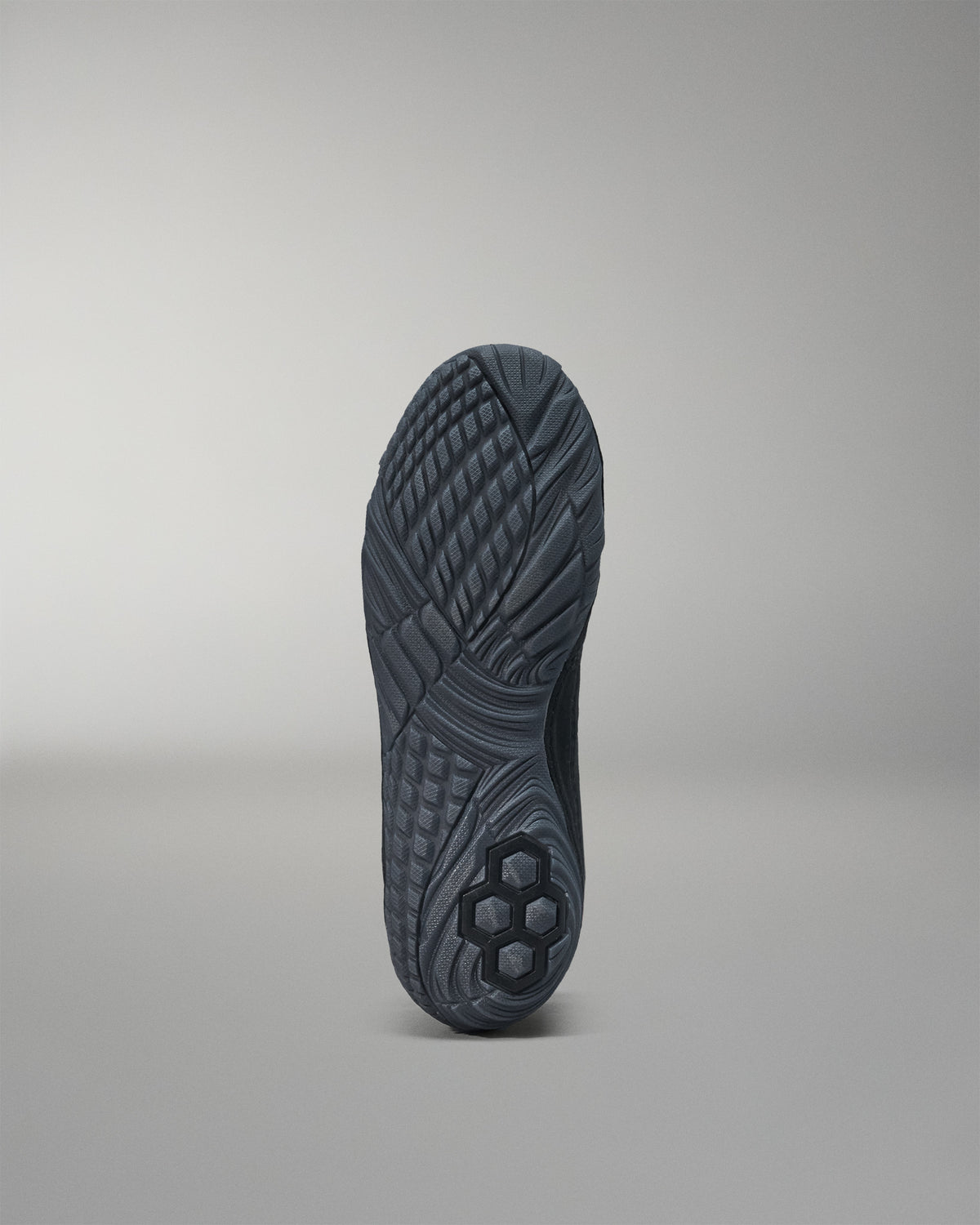 Black sole of a shoe on a gray background