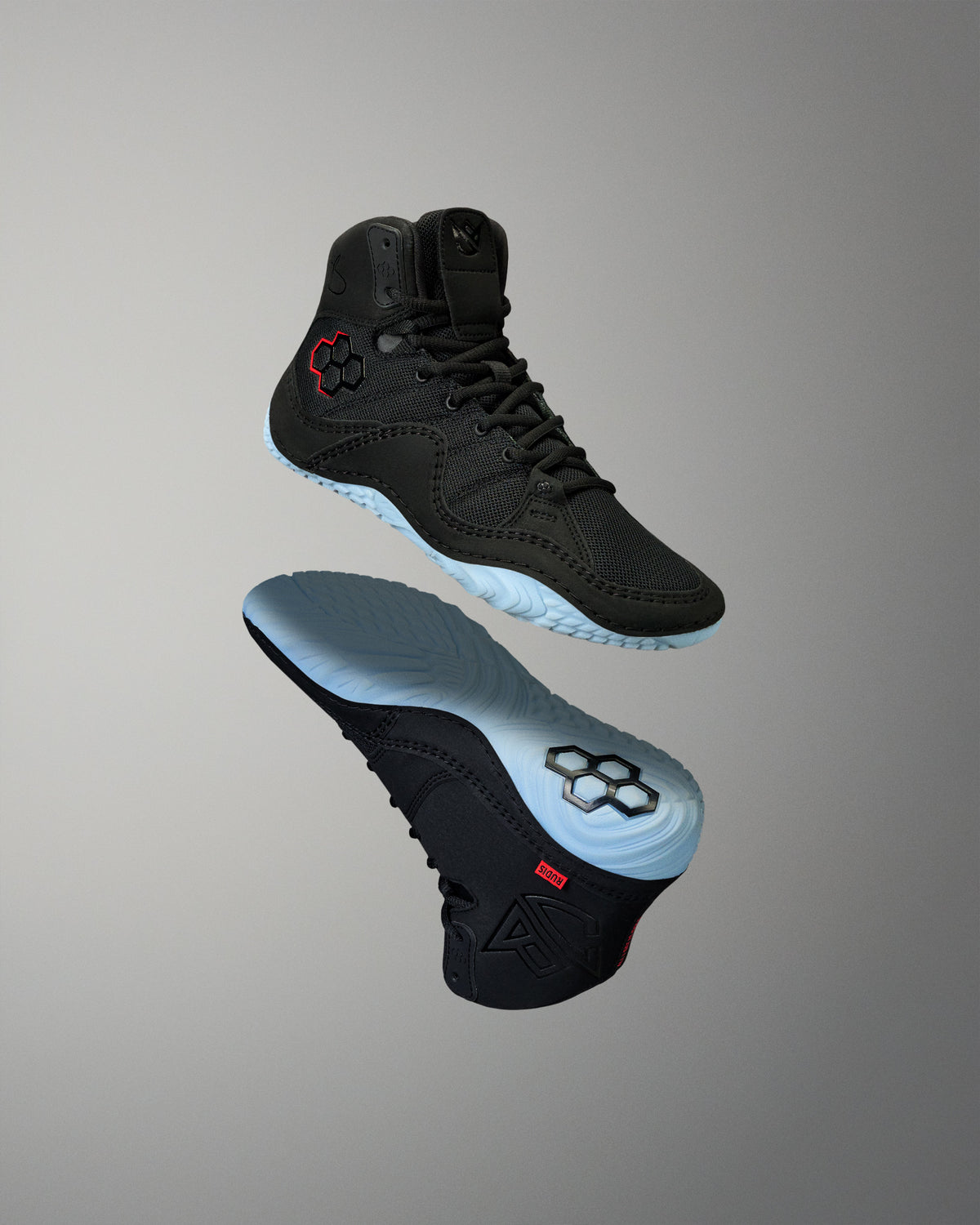 RUDIS JB1 Youth Wrestling Shoes in Dark Shark shown from upper and outsole angles, highlighting the black construction, red RUDIS accents, and light blue traction outsole.