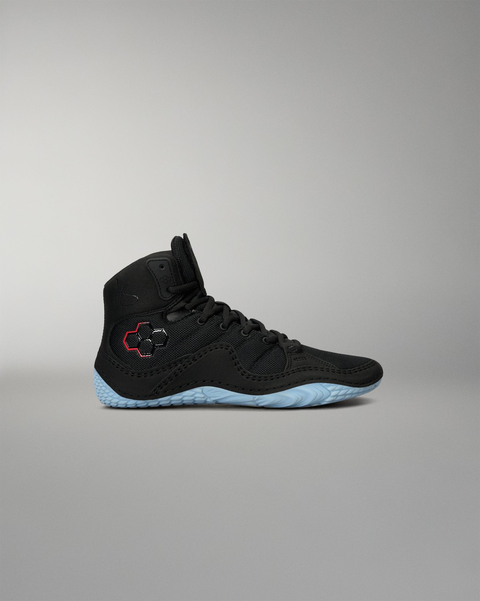 RUDIS JB1 Youth Wrestling Shoe in Dark Shark shown from the lateral side, featuring a black mesh and synthetic upper, RUDIS logo detail, and light blue outsole.