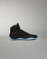 RUDIS JB1 Youth Wrestling Shoe in Dark Shark shown from the lateral side, featuring a black mesh and synthetic upper, RUDIS logo detail, and light blue outsole.