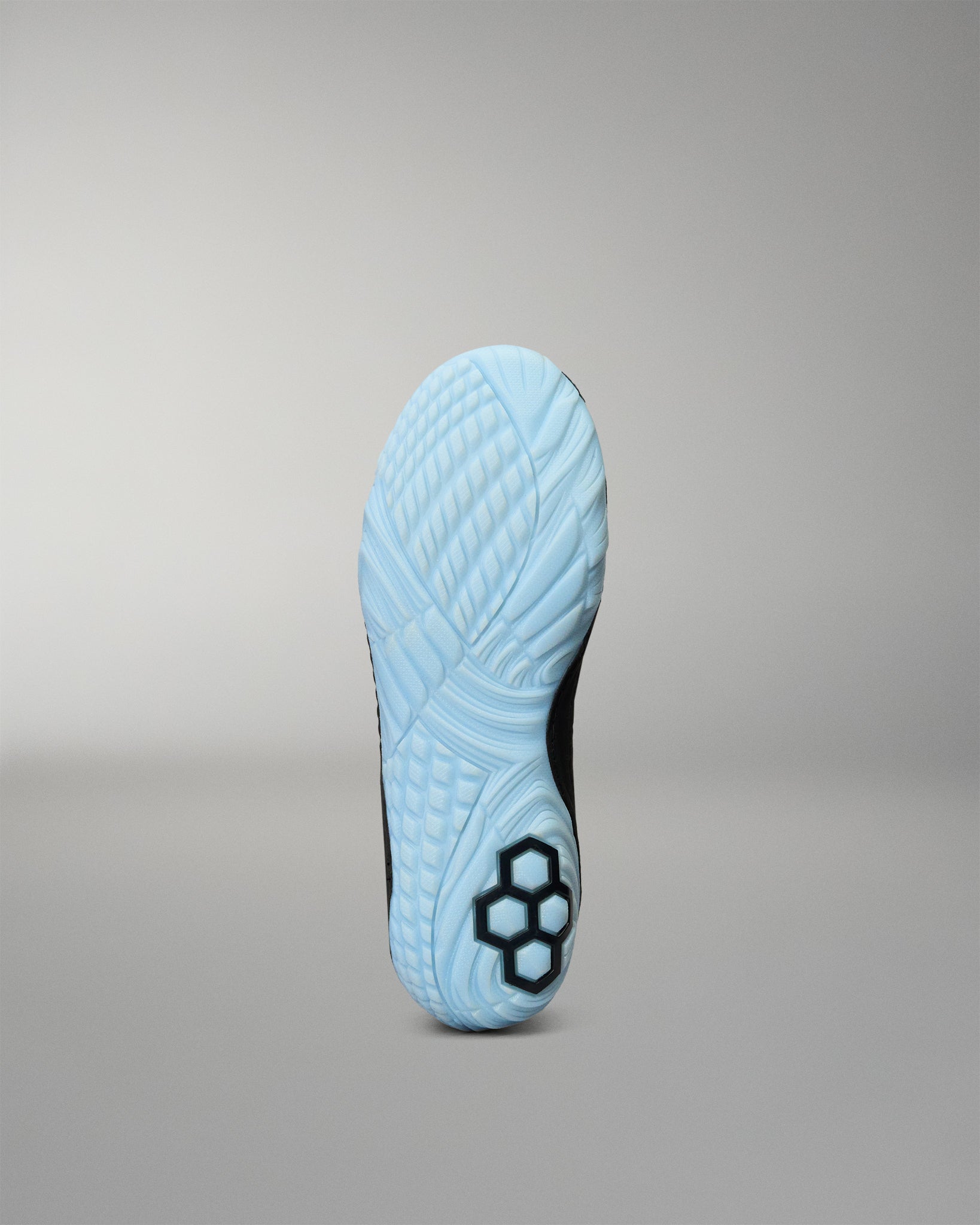 RUDIS JB1 Youth Wrestling Shoe in Dark Shark shown from the bottom, highlighting the light blue textured traction outsole and RUDIS logo detail.