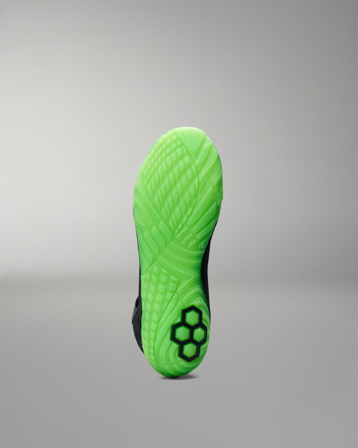 Green sole of a Wrestling shoe on a gray background