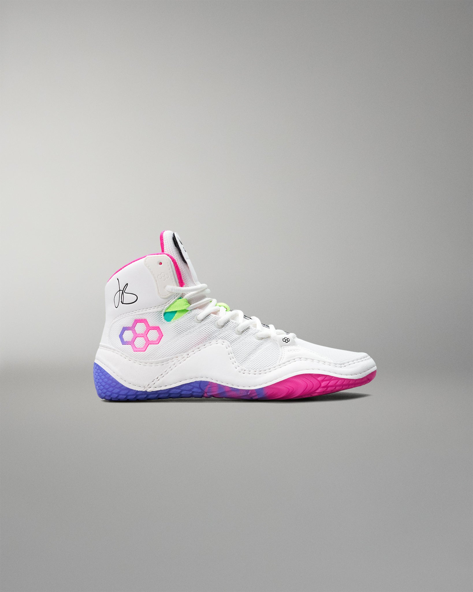 White wrestling shoe with colorful accents on a gray background