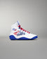 Side view of a white RUDIS KS Infinity Edge Wrestling Shoe featuring a red, white, and blue USA flag-inspired design, red laces, blue outsole, RUDIS hexagon logo near the ankle, and official USA Wrestling branding