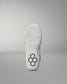 White wrestling shoe sole with a textured pattern and hexagonal logo on a gray background