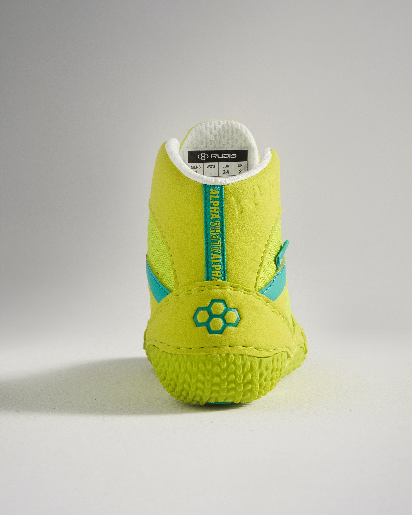 A vibrant yellow athletic shoe featuring a unique textured sole and blue accents designed for optimal performance in sports