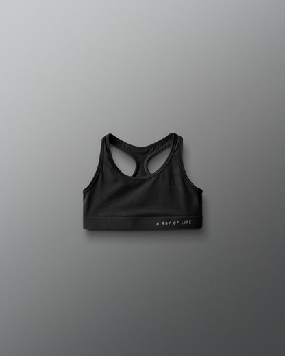 Black sports bra on a gray background
