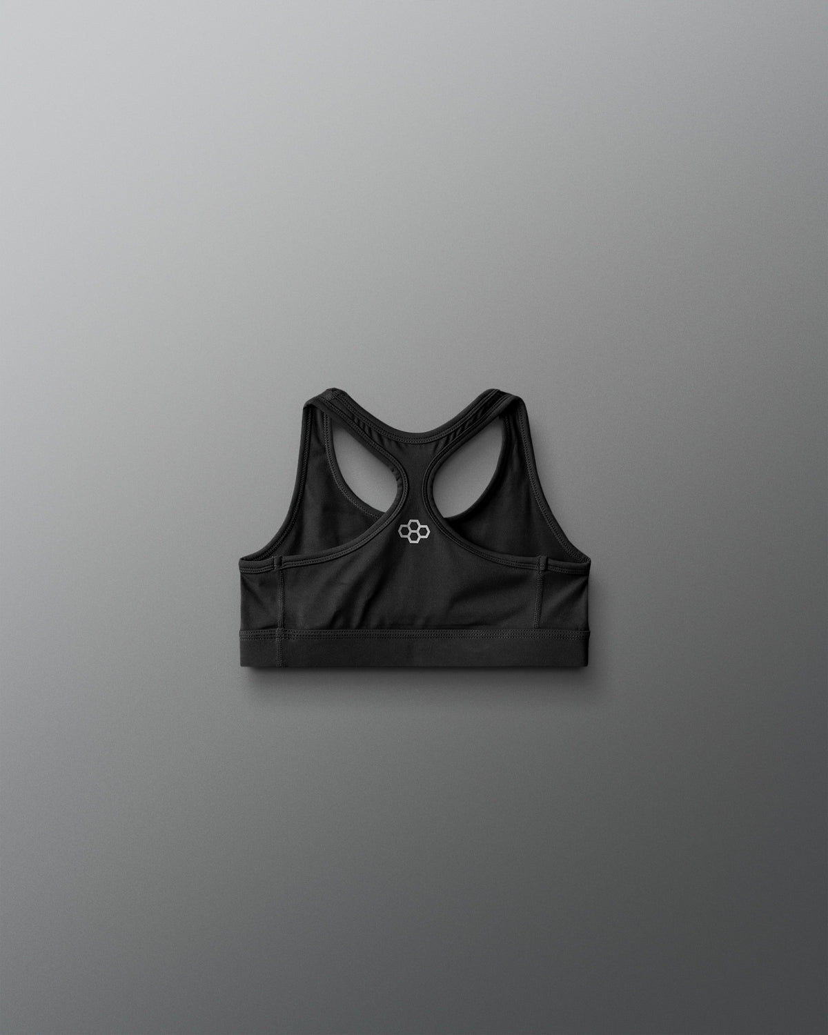 Black sports bra on a gray background