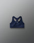Navy blue sports bra on a gray background
