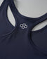 Navy blue sports bra with a hexagonal logo on a light gray background