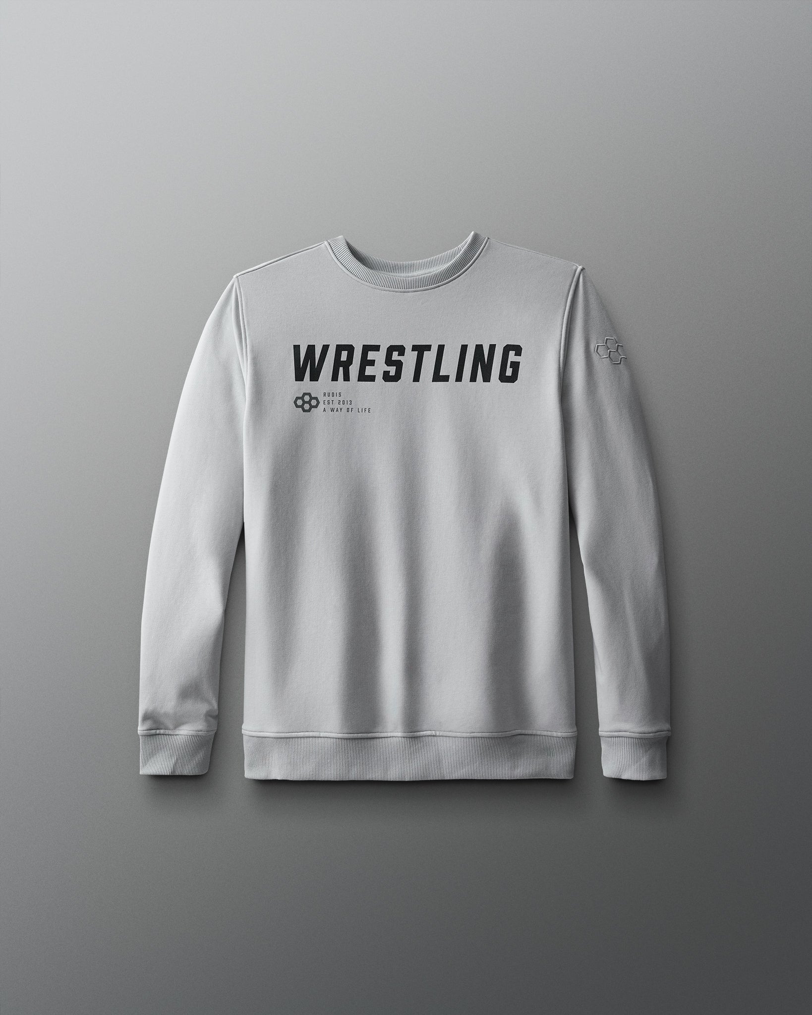 A navy blue youth crewneck sweatshirt with the text 'WRESTLING' printed in large white letters on the front.