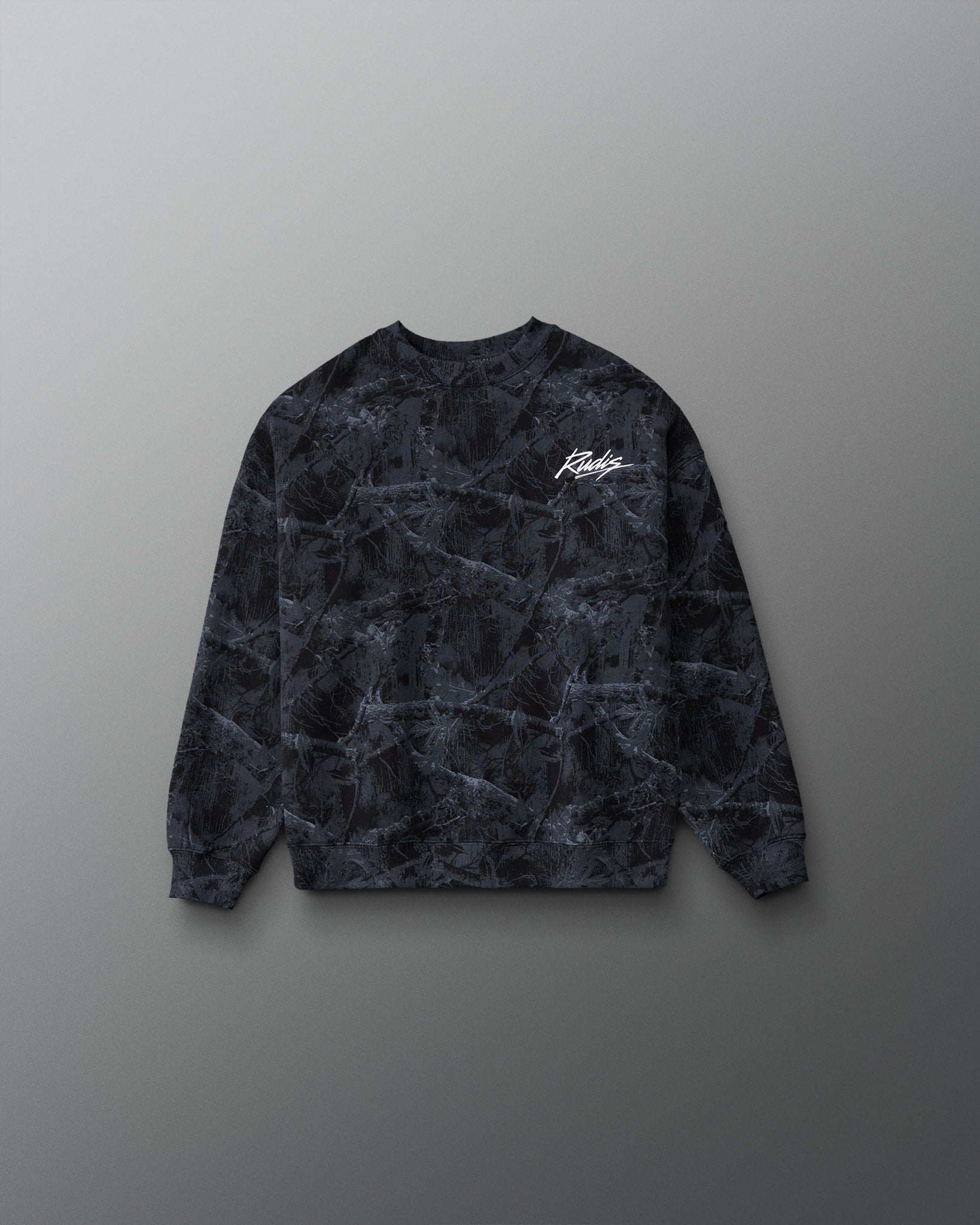 RUDIS Wrestling Youth Relaxed Comfort Fleece Crewneck in Black Camo, front view with dark woodland camouflage pattern and white RUDIS script chest logo.