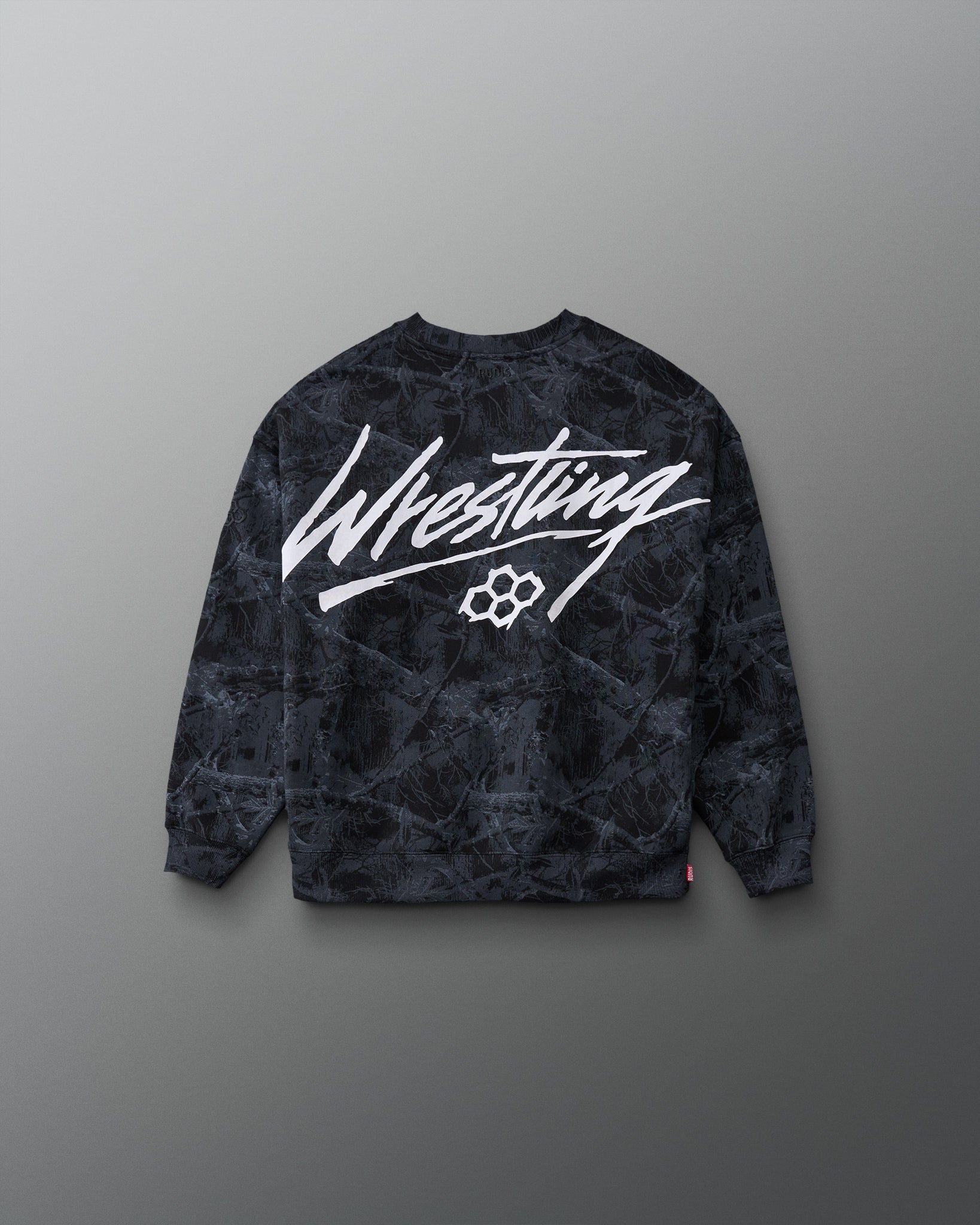 RUDIS Wrestling Youth Relaxed Comfort Fleece Crewneck in Black Camo, back view featuring bold white Wrestling script graphic and RUDIS hex logo over camouflage print.